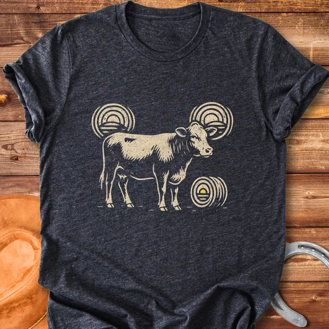 Abstract design t-shirt featuring a cow silhouette and stylized hay bales.