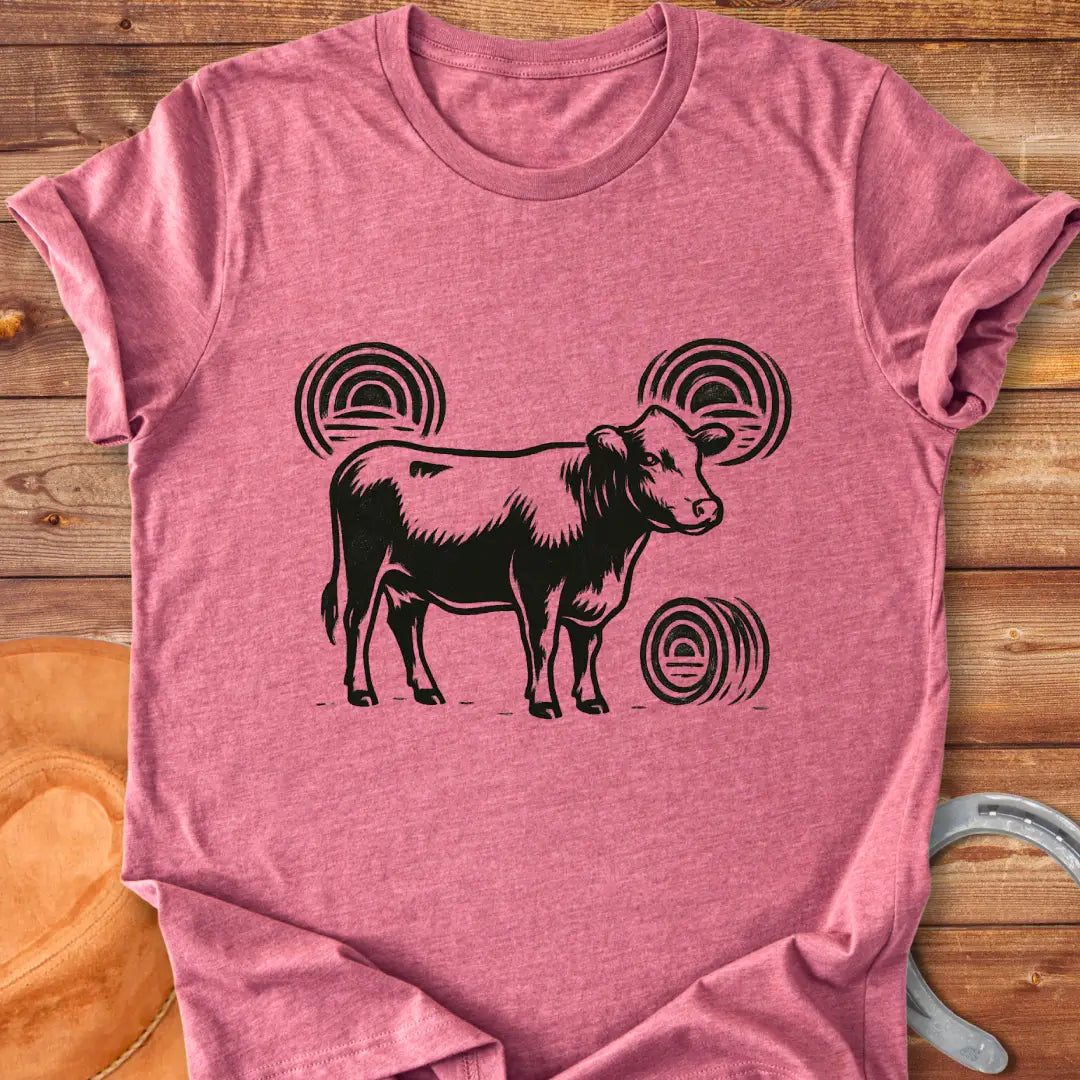 Abstract design t-shirt featuring a cow silhouette and stylized hay bales.