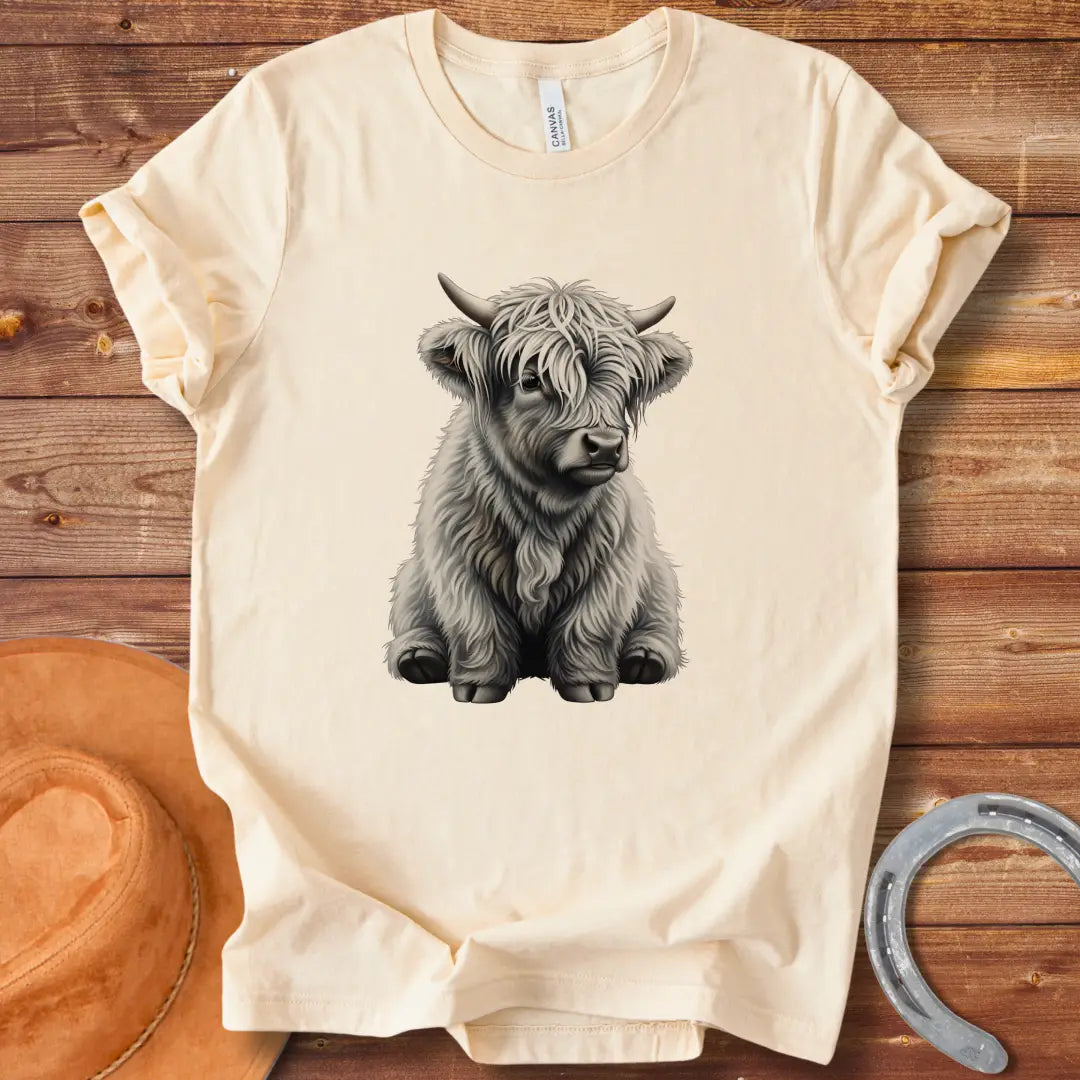 Illustration of a cute baby Highland cow with long white fur and small horns, sitting down and looking friendly.