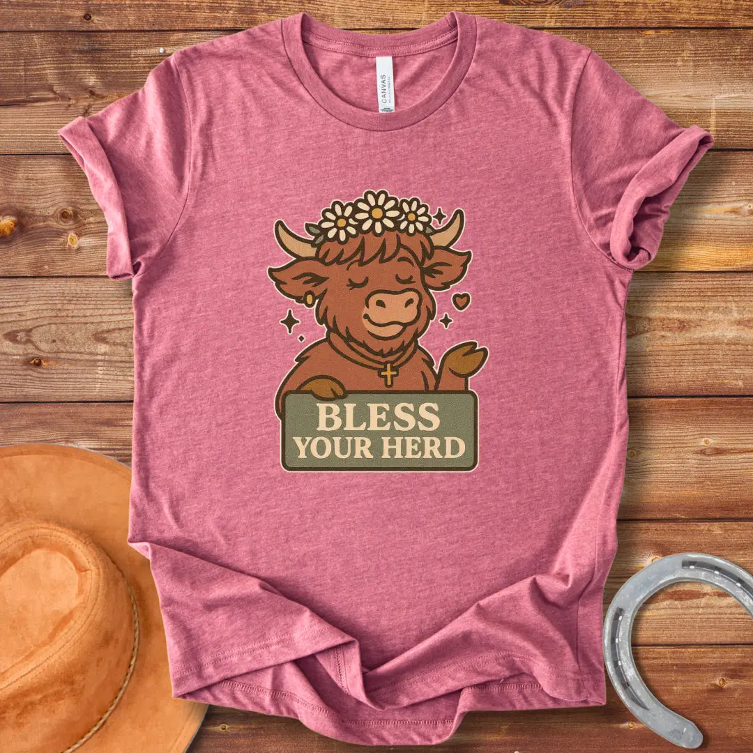 Illustration of a happy Highland cow wearing a flower crown and cross necklace, holding a sign that says 'Bless Your Herd'.