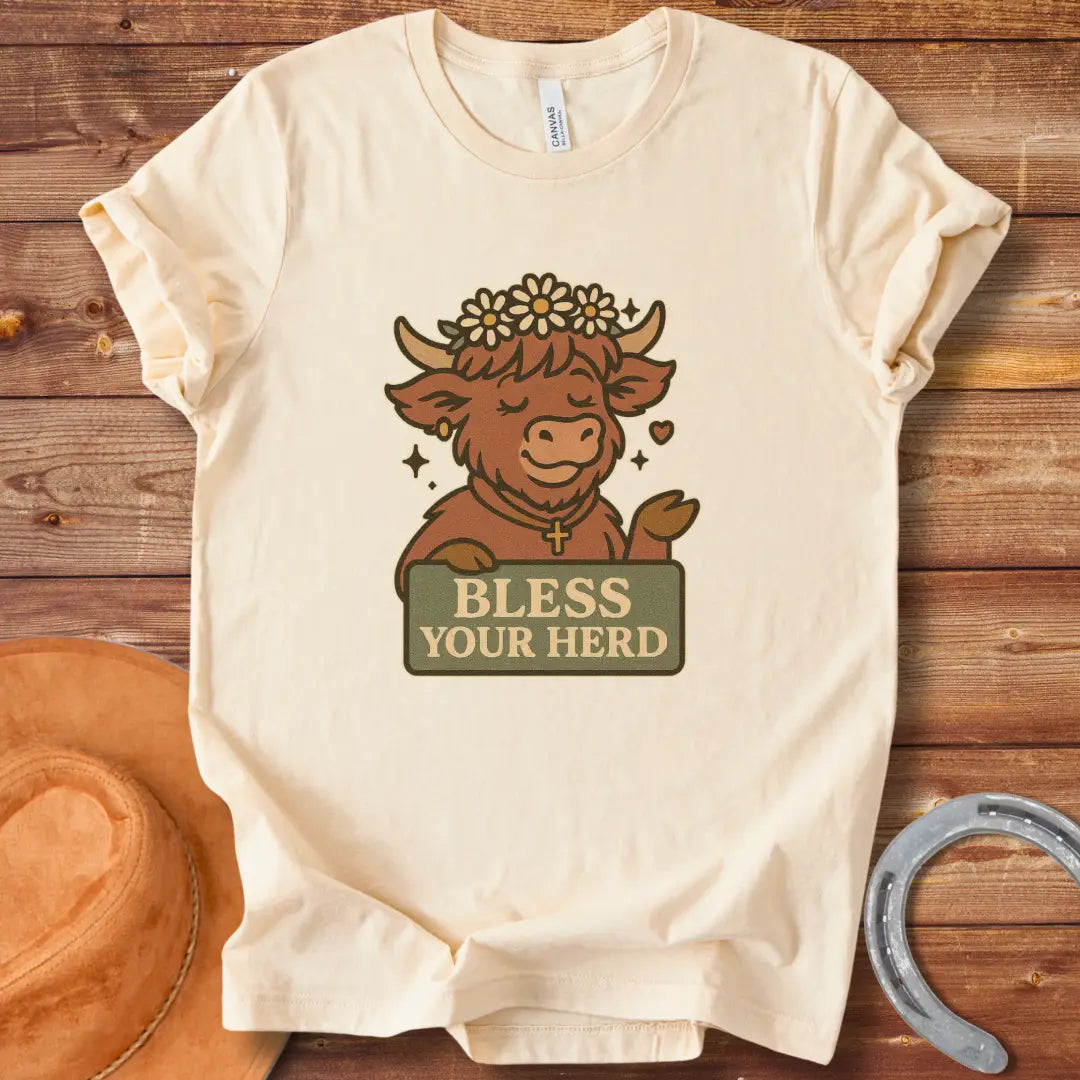Illustration of a happy Highland cow wearing a flower crown and cross necklace, holding a sign that says 'Bless Your Herd'.