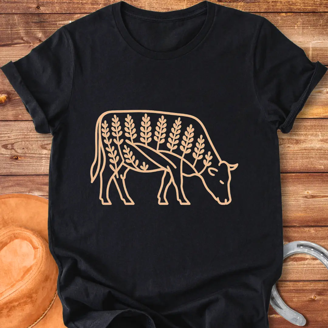 Bluebonnet cow illustration t-shirt design, showing a cow with floral elements within its silhouette.