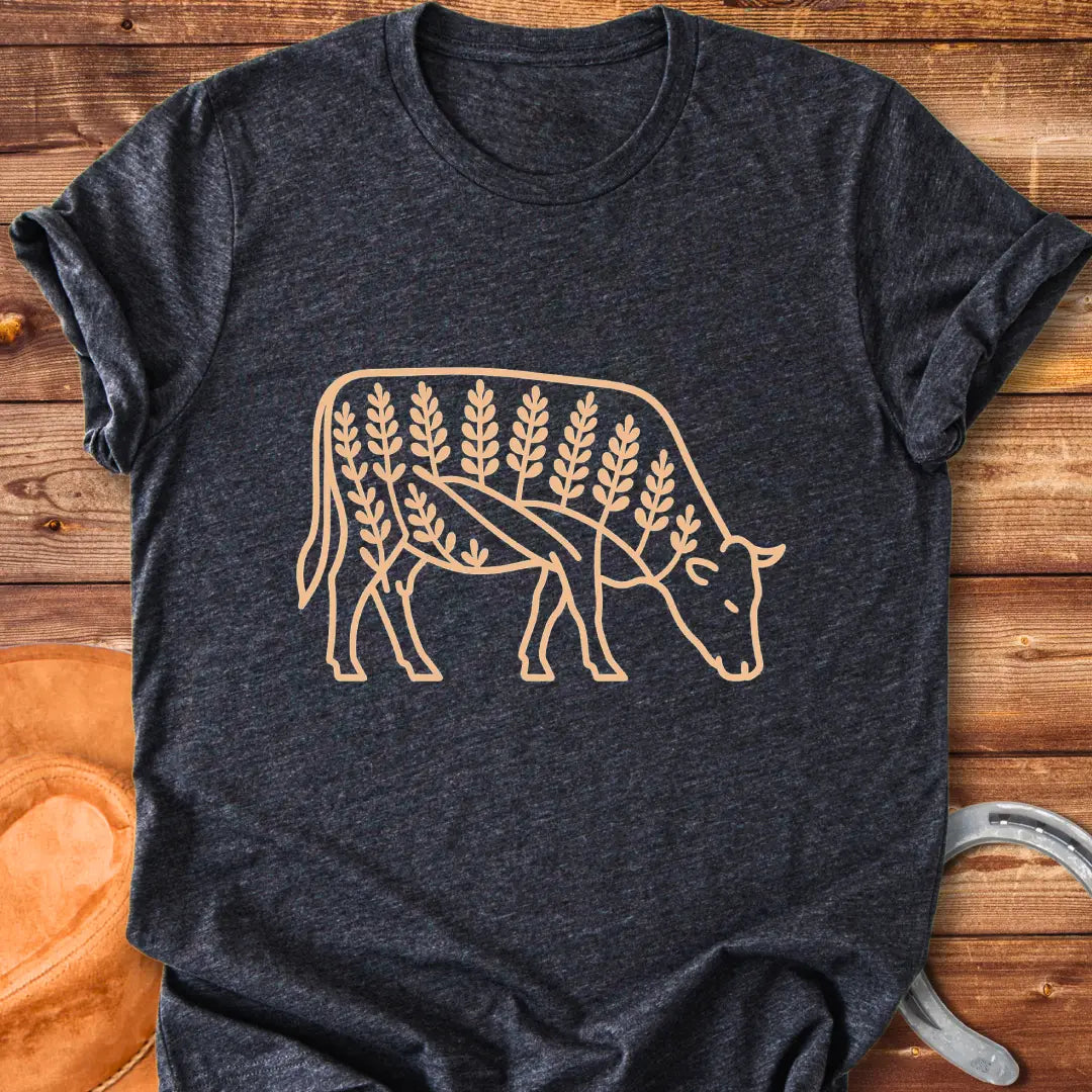 Bluebonnet cow illustration t-shirt design, showing a cow with floral elements within its silhouette.