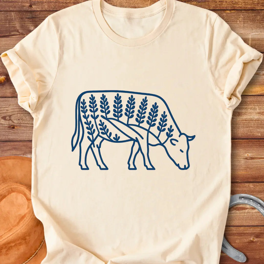 Bluebonnet cow illustration t-shirt design, showing a cow with floral elements within its silhouette.
