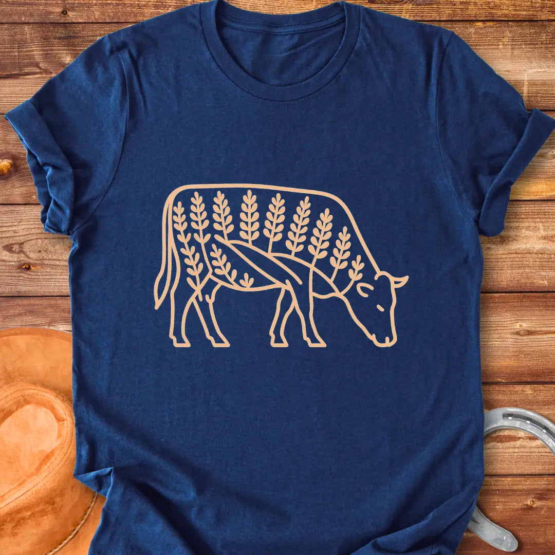 Bluebonnet cow illustration t-shirt design, showing a cow with floral elements within its silhouette.