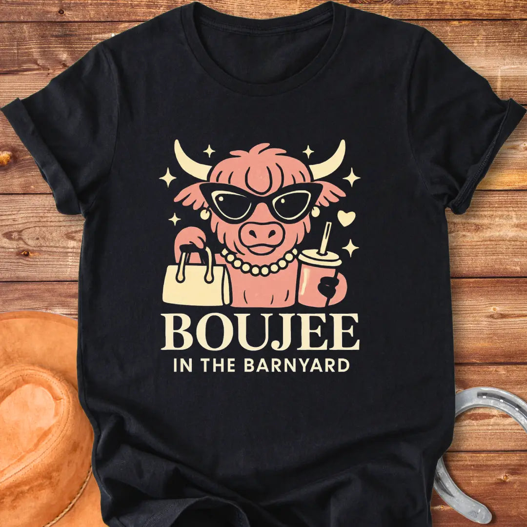 Boujee highland cow wearing sunglasses, pearls, and holding a purse and drink. The design says 'Boujee in the Barnyard'.