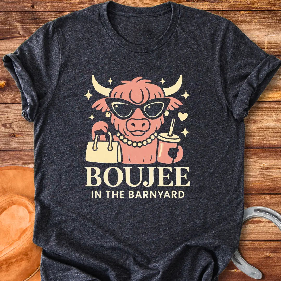 Boujee highland cow wearing sunglasses, pearls, and holding a purse and drink. The design says 'Boujee in the Barnyard'.