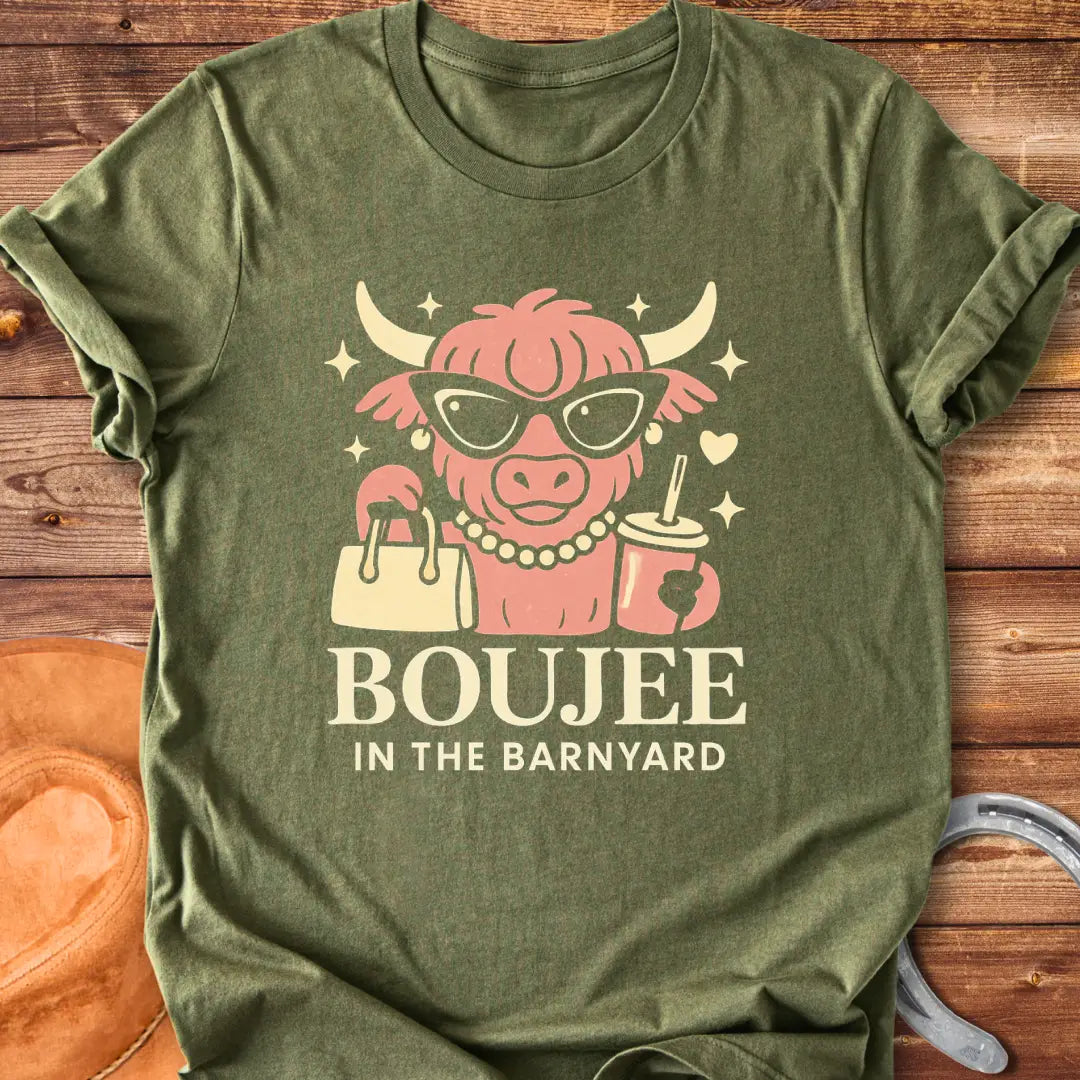 Boujee highland cow wearing sunglasses, pearls, and holding a purse and drink. The design says 'Boujee in the Barnyard'.