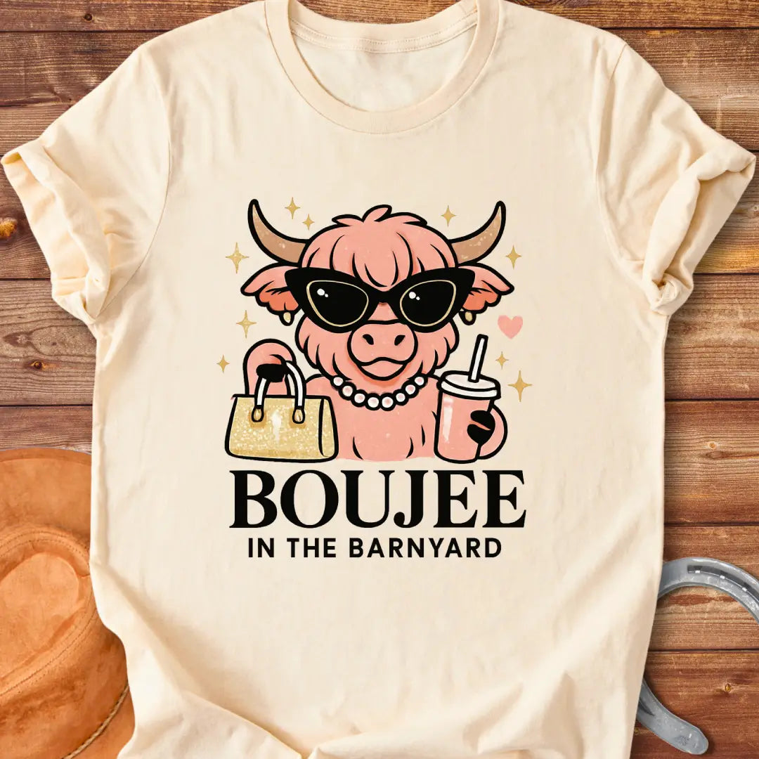 Boujee highland cow wearing sunglasses, pearls, and holding a purse and drink. The design says 'Boujee in the Barnyard'.