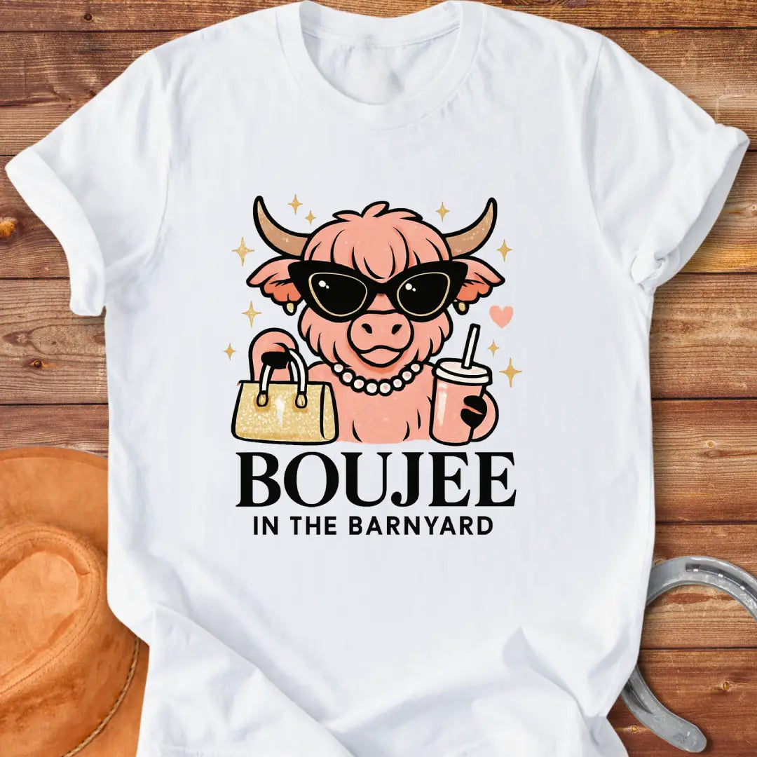Boujee highland cow wearing sunglasses, pearls, and holding a purse and drink. The design says 'Boujee in the Barnyard'.