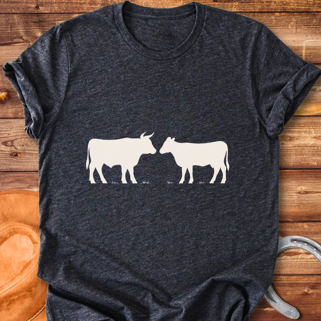 Bull & Heifer Standoff T-Shirt design t-shirt, showing a graphic of a cow.