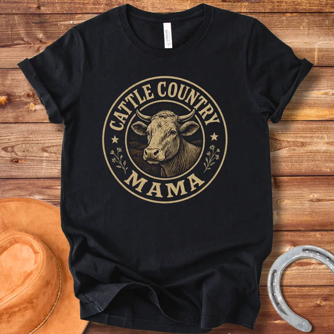A sepia-toned illustration of a cow's head, surrounded by a circular design that reads 'Cattle Country Mama'.