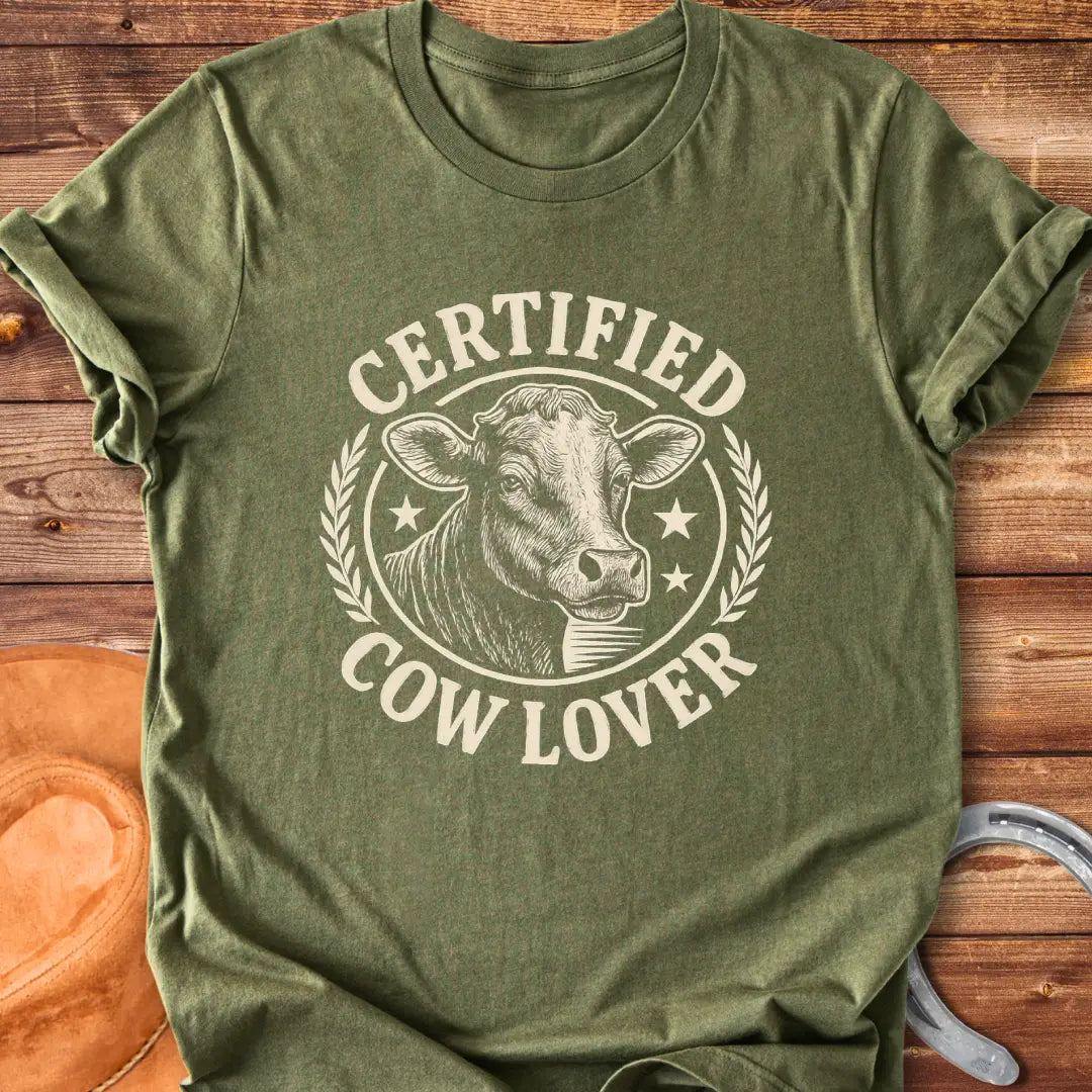 Vintage dark t-shirt with a detailed illustration of a cow and text that says 'Certified Cow Lover'.