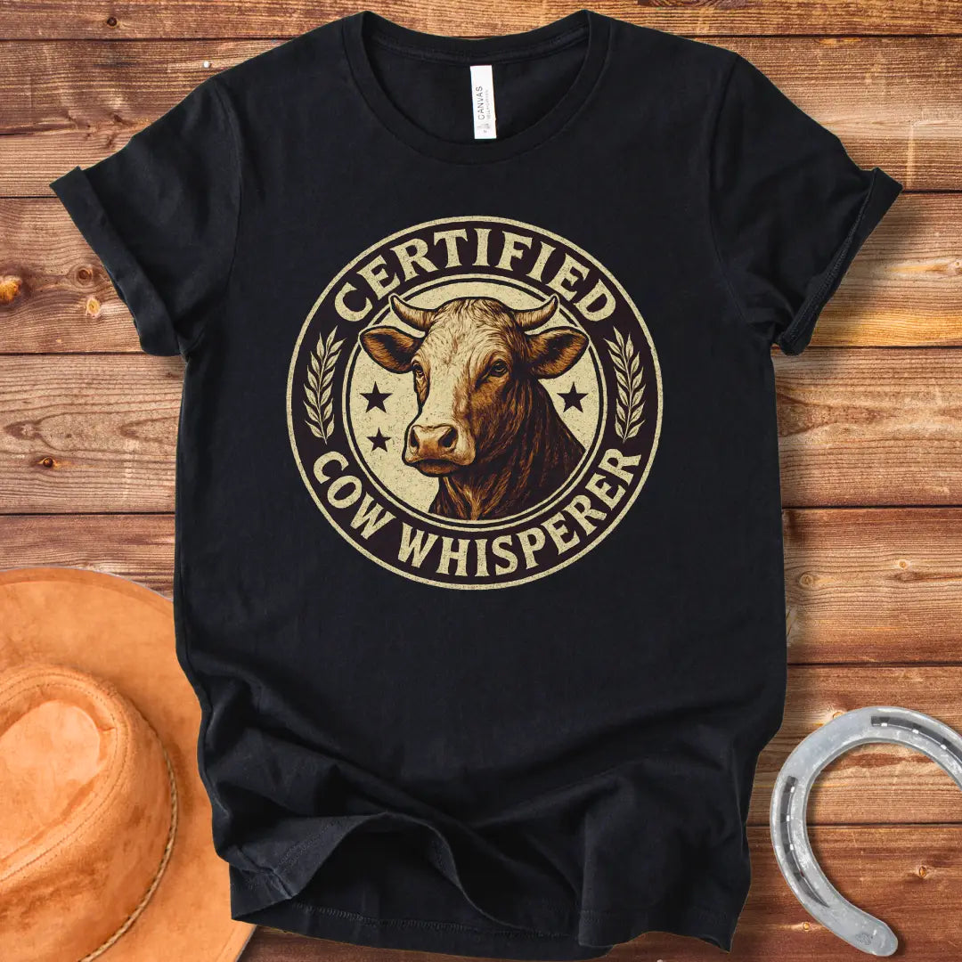 Certified Cow Whisperer T-Shirt design featuring a detailed cow face within a circular badge.