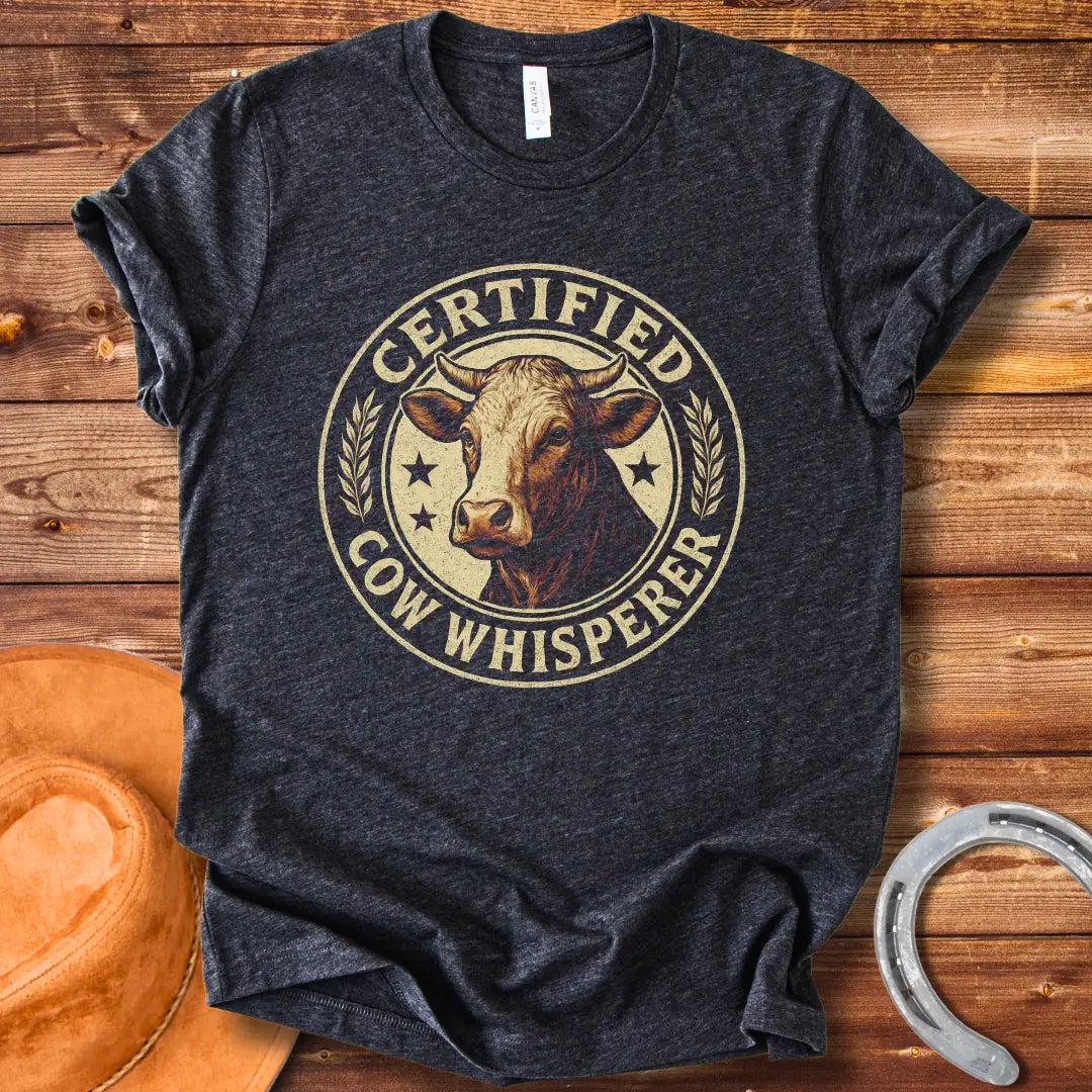 Certified Cow Whisperer T-Shirt design featuring a detailed cow face within a circular badge.