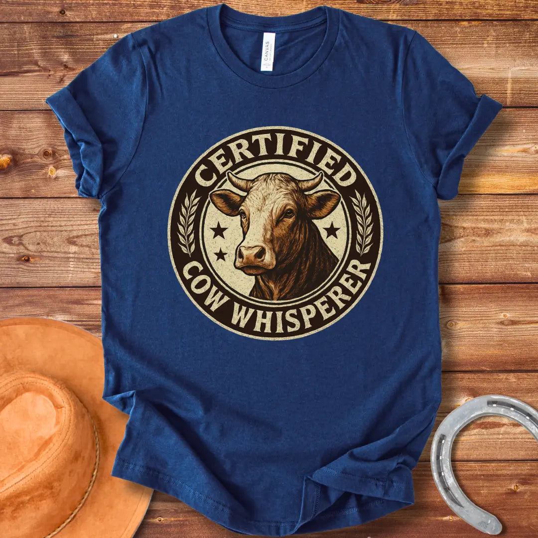 Certified Cow Whisperer T-Shirt design featuring a detailed cow face within a circular badge.