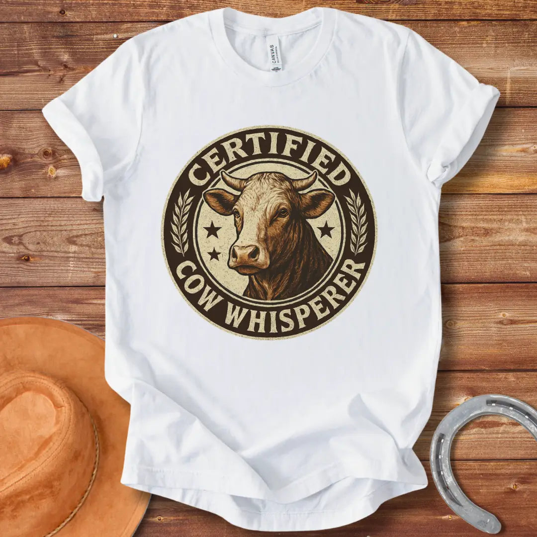 Certified Cow Whisperer T-Shirt design featuring a detailed cow face within a circular badge.