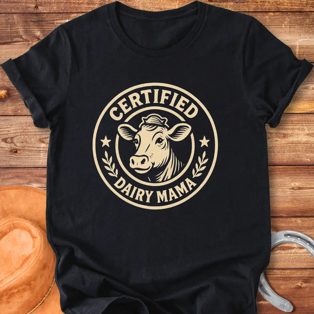 Certified Dairy Mama t-shirt design featuring a cow with a crown inside a circular logo.