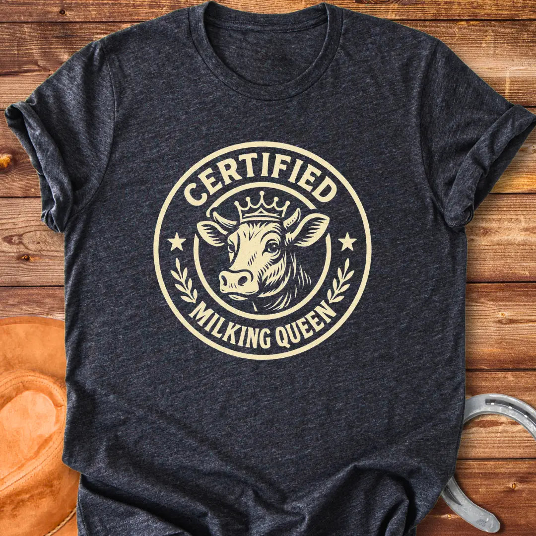 Certified Milking Queen T-Shirt design with a cow wearing a crown, and the words 'Certified Milking Queen' in a circular emblem.