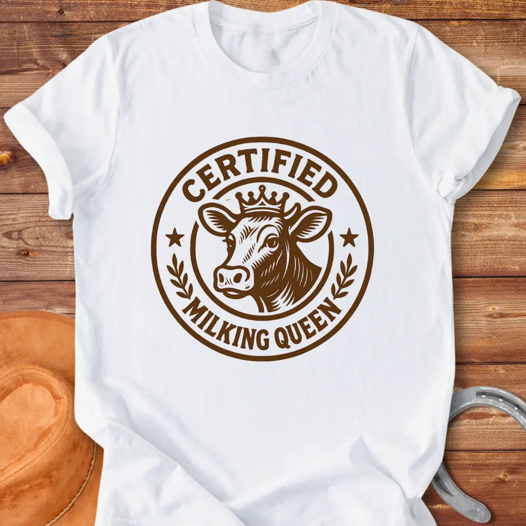 Certified Milking Queen T-Shirt design with a cow wearing a crown, and the words 'Certified Milking Queen' in a circular emblem.