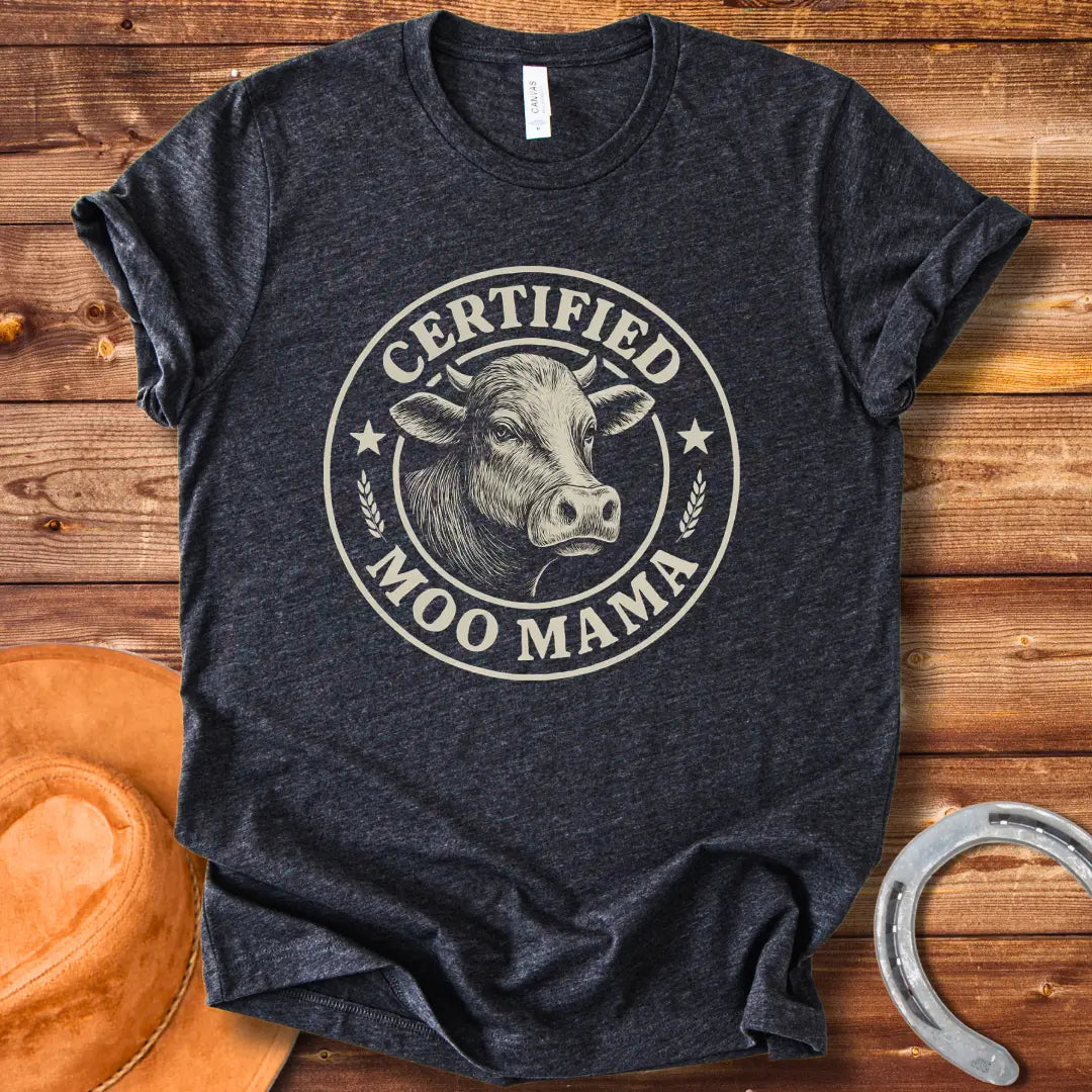 Certified Moo Mama T-shirt design with a detailed illustration of a cow's head inside a seal with the words 'Certified Moo Mama' around the edge.