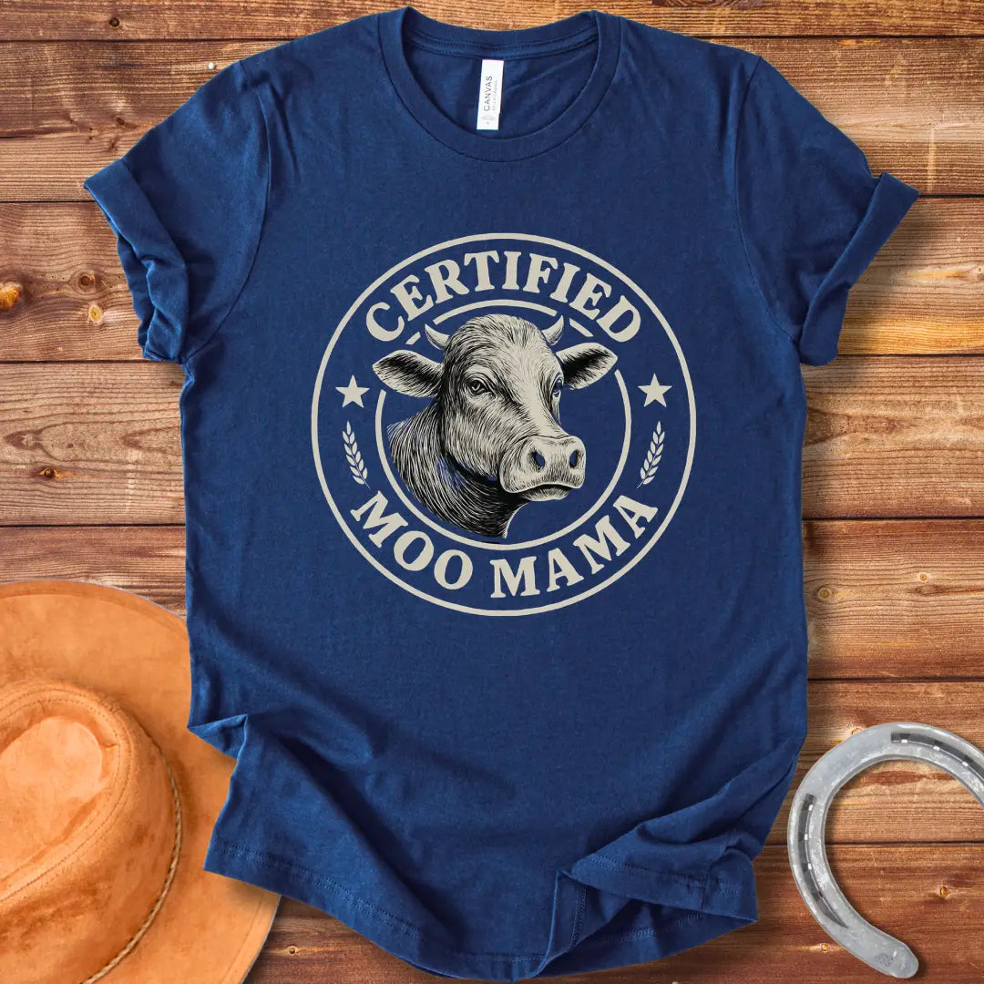 Certified Moo Mama T-shirt design with a detailed illustration of a cow's head inside a seal with the words 'Certified Moo Mama' around the edge.