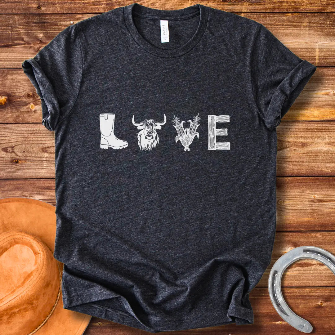 Cow Love T-Shirt featuring a design with the word 'LOVE' stylized with farm and plant imagery on a black background.