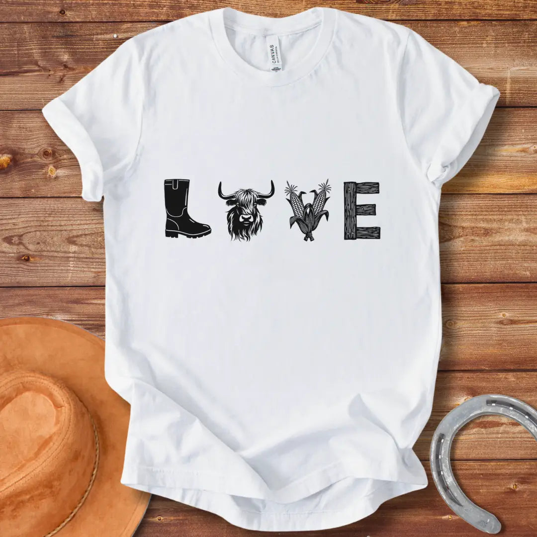 Cow Love T-Shirt featuring a design with the word 'LOVE' stylized with farm and plant imagery on a black background.