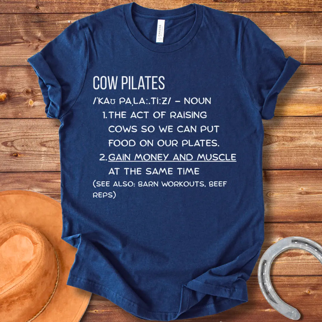 A stylish black t-shirt design featuring a cow doing pilates, against a black background.