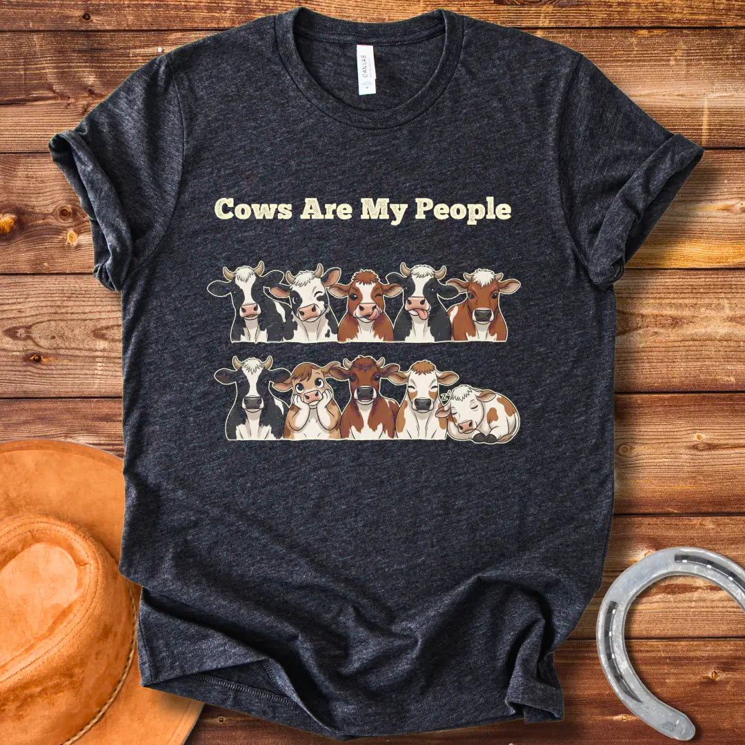 Cows Are My People T-shirt featuring a design of cartoon cows winking and smiling