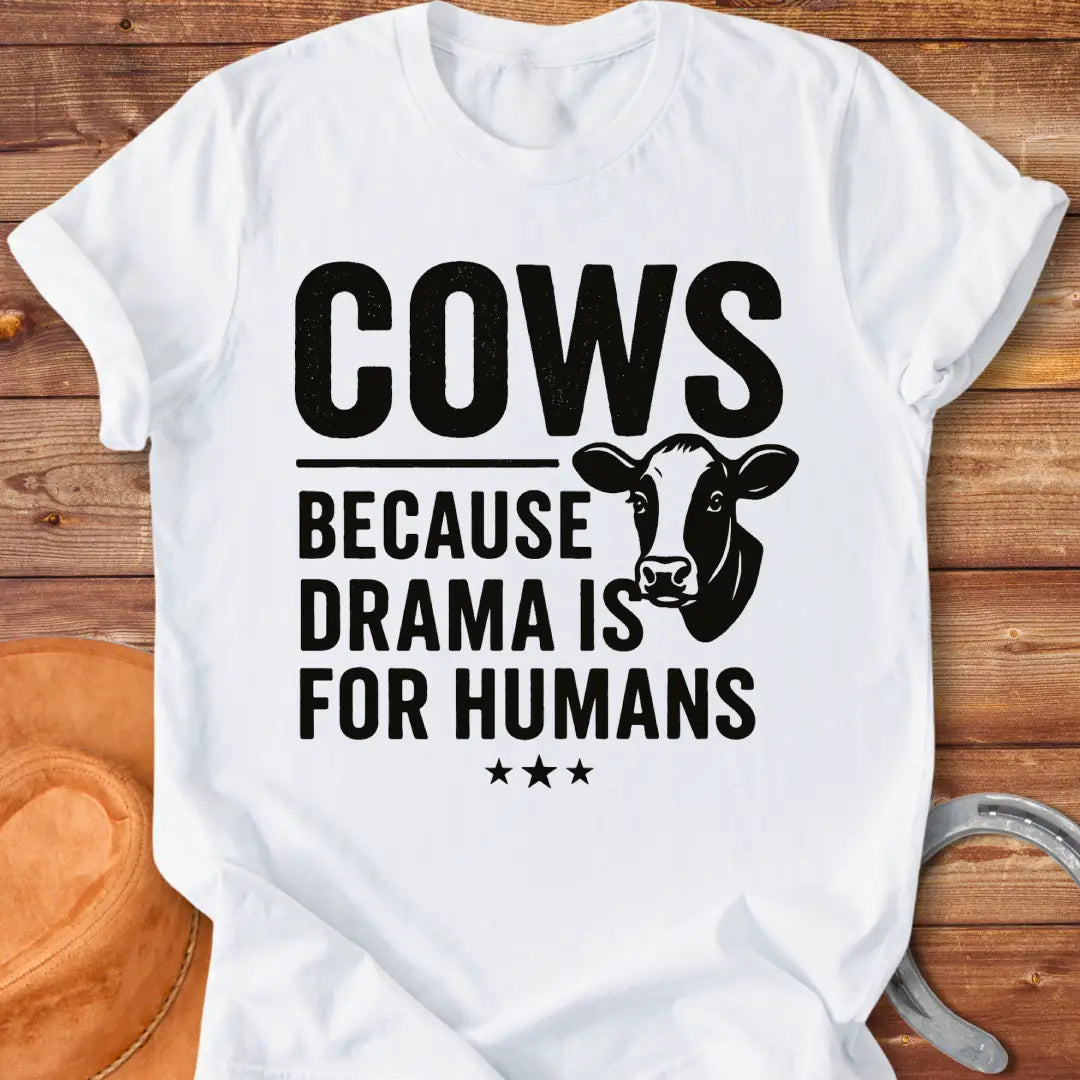 Black t-shirt design with the words 'Cows because drama is for humans' and a cow head illustration.