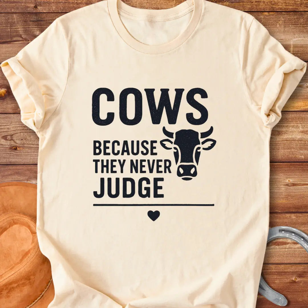 Cows Because They Never Judge T-Shirt design featuring a cow illustration