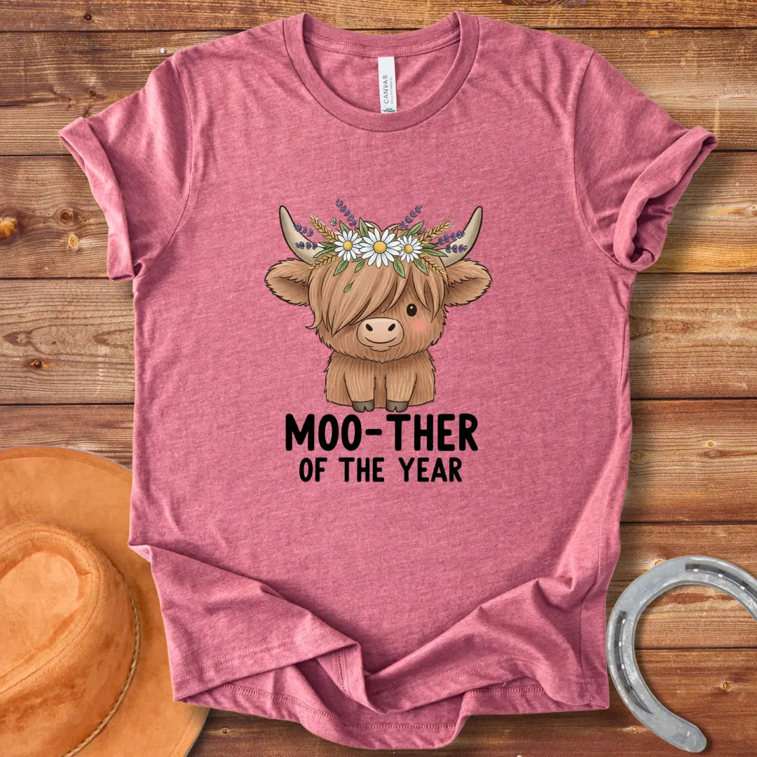 Cute Highland cow wearing a flower crown, with the text 'Moo-ther of the Year'.