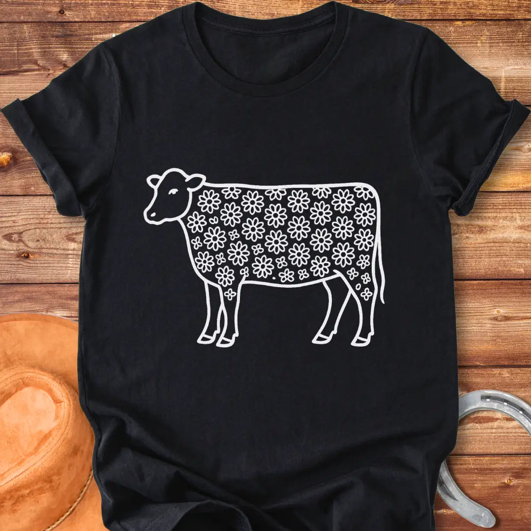 Line art illustration of a cow with a floral pattern filling the body
