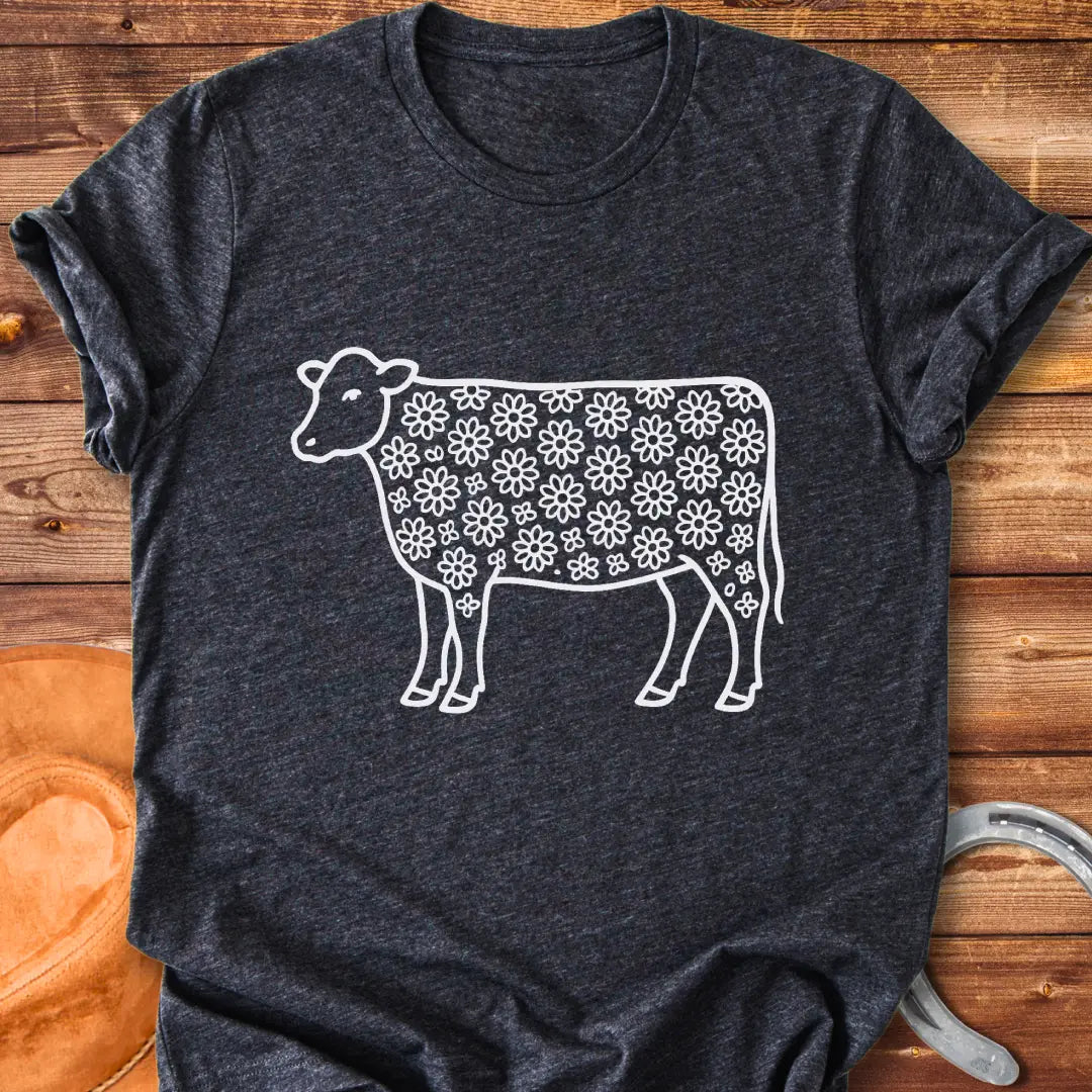 Line art illustration of a cow with a floral pattern filling the body
