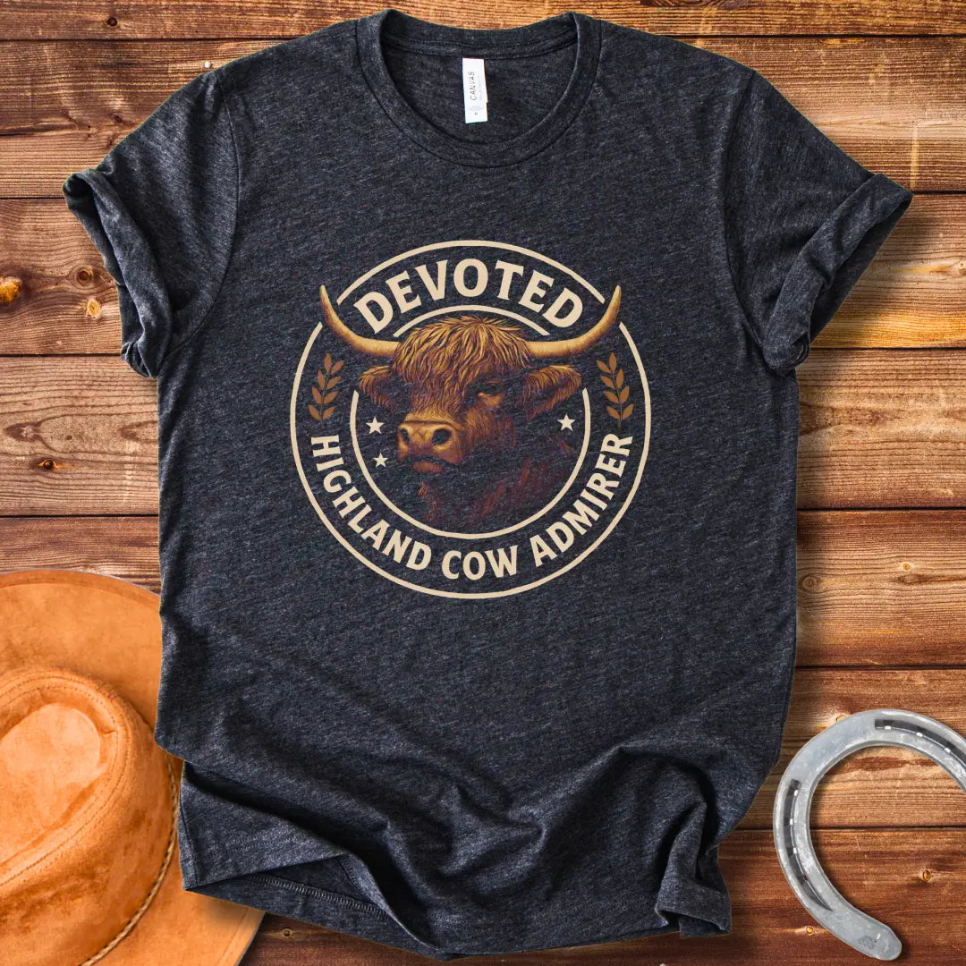 Devoted Highland Cow Admirer T-Shirt design featuring a detailed illustration of a Highland cow's head inside a circular frame with text.