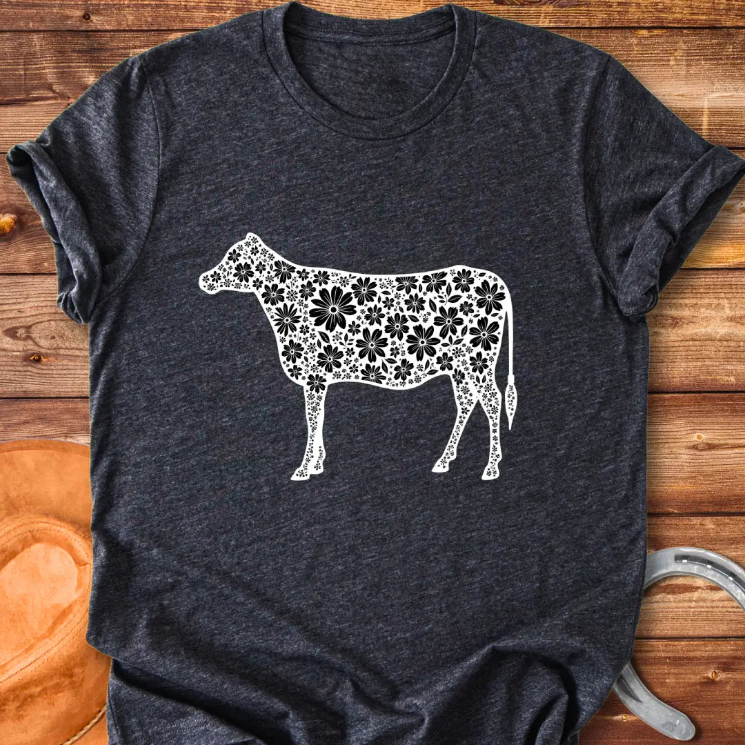 Floral cow t-shirt featuring a cow silhouette filled with white floral elements on a black background