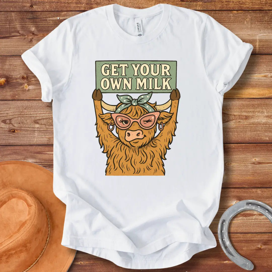 A sassy highland cow wearing sunglasses, holding a sign that reads 'Get Your Own Milk'