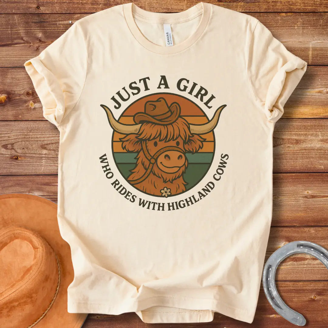 Girl with highland cow t-shirt. A smiling highland cow wearing a hat in a retro design.