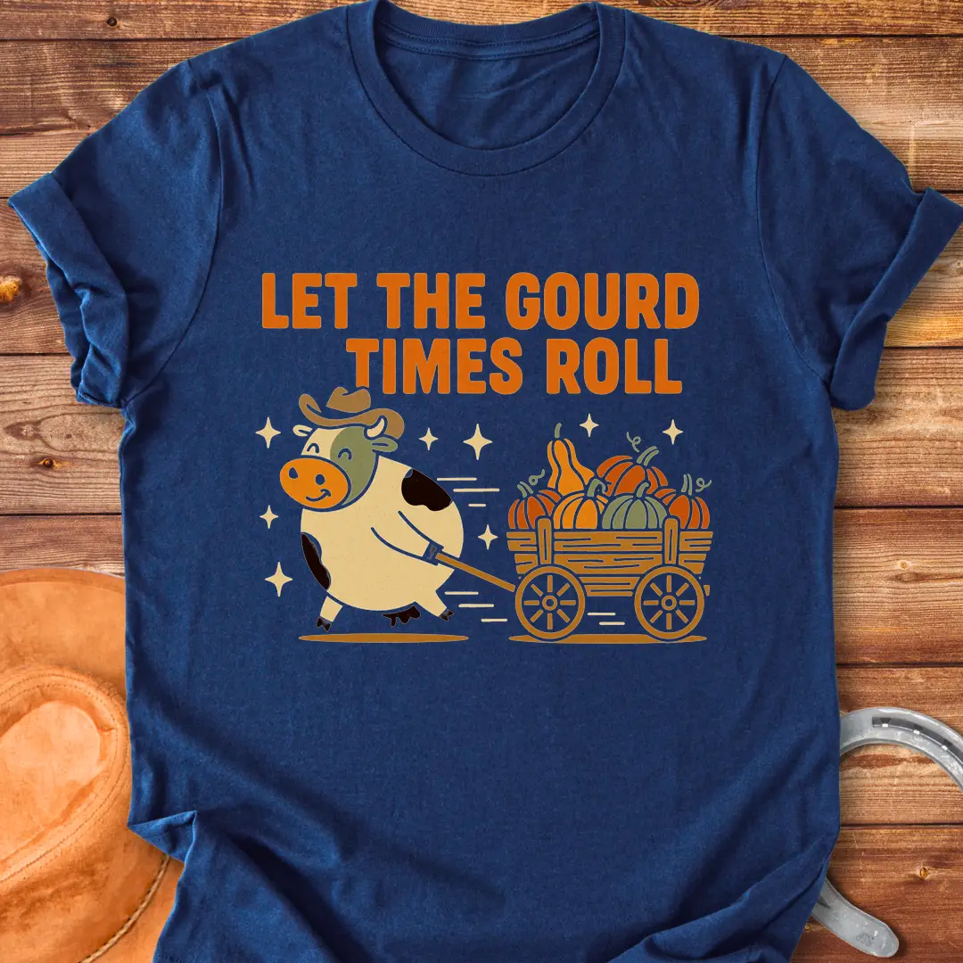Cow pulling a wagon full of pumpkins with the text 'Let the Gourd Times Roll' – a fall-themed t-shirt design from Cow Lovers Clothing.