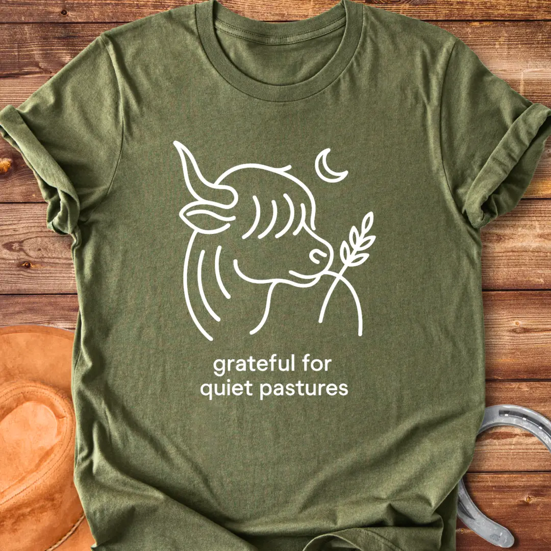 Line art of a Highland cow enjoying a sprig of grass, with the words 'grateful for quiet pastures'