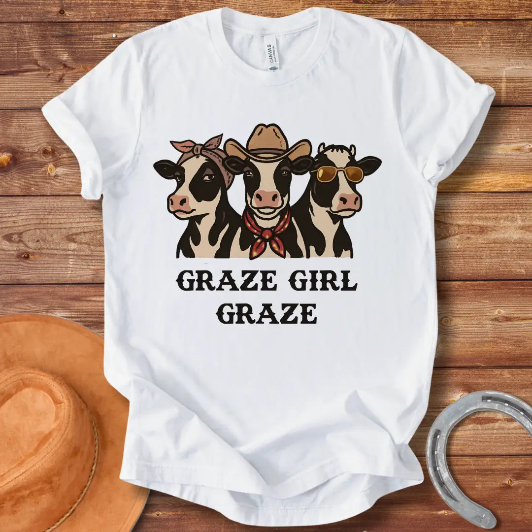 Graze Girl Graze T-Shirt featuring a trio of stylish cows wearing a bandana, a cowboy hat, and sunglasses.