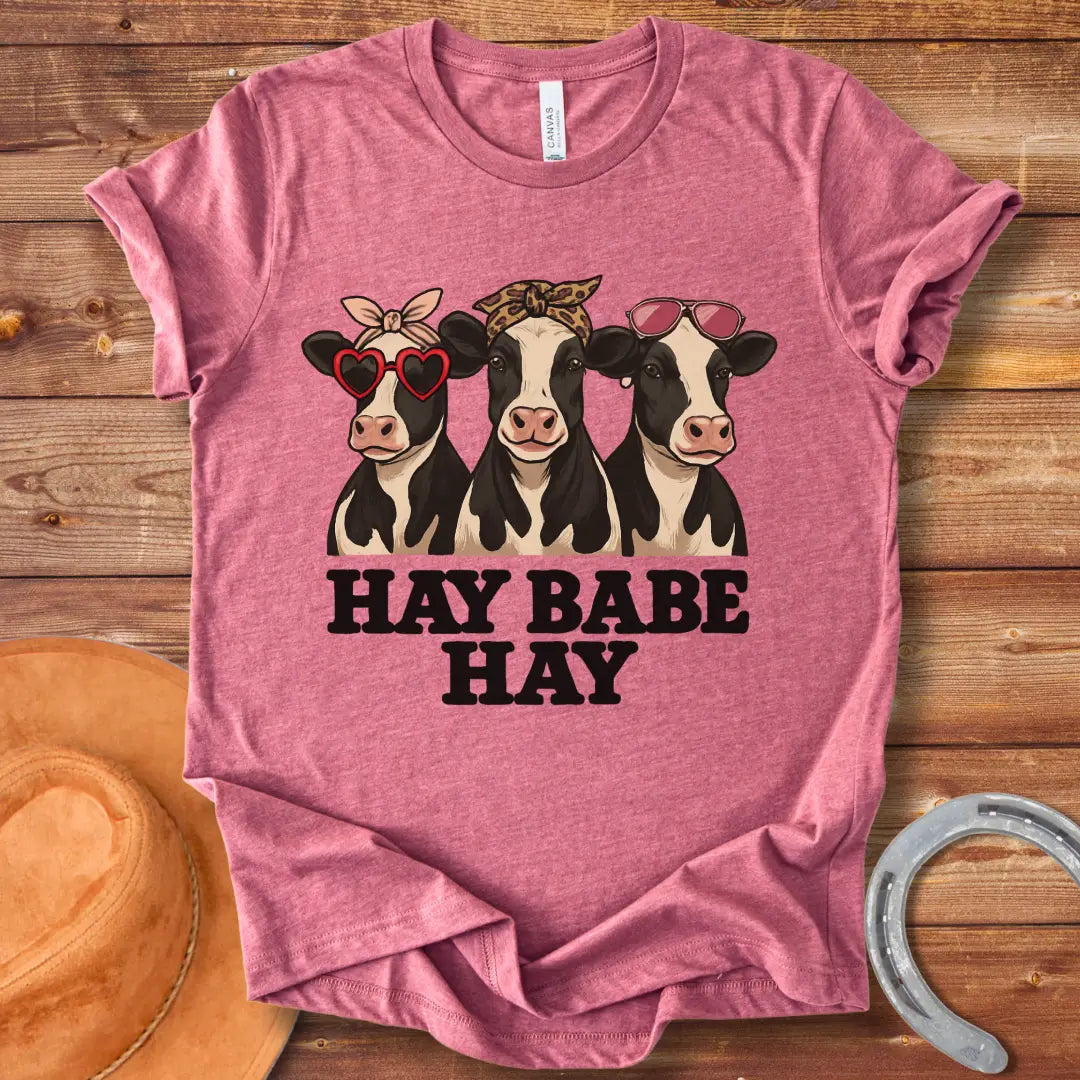 Hay Babe Hay T-Shirt featuring three stylish cows wearing sunglasses and bandanas. Text reads 'Hay Babe Hay'.