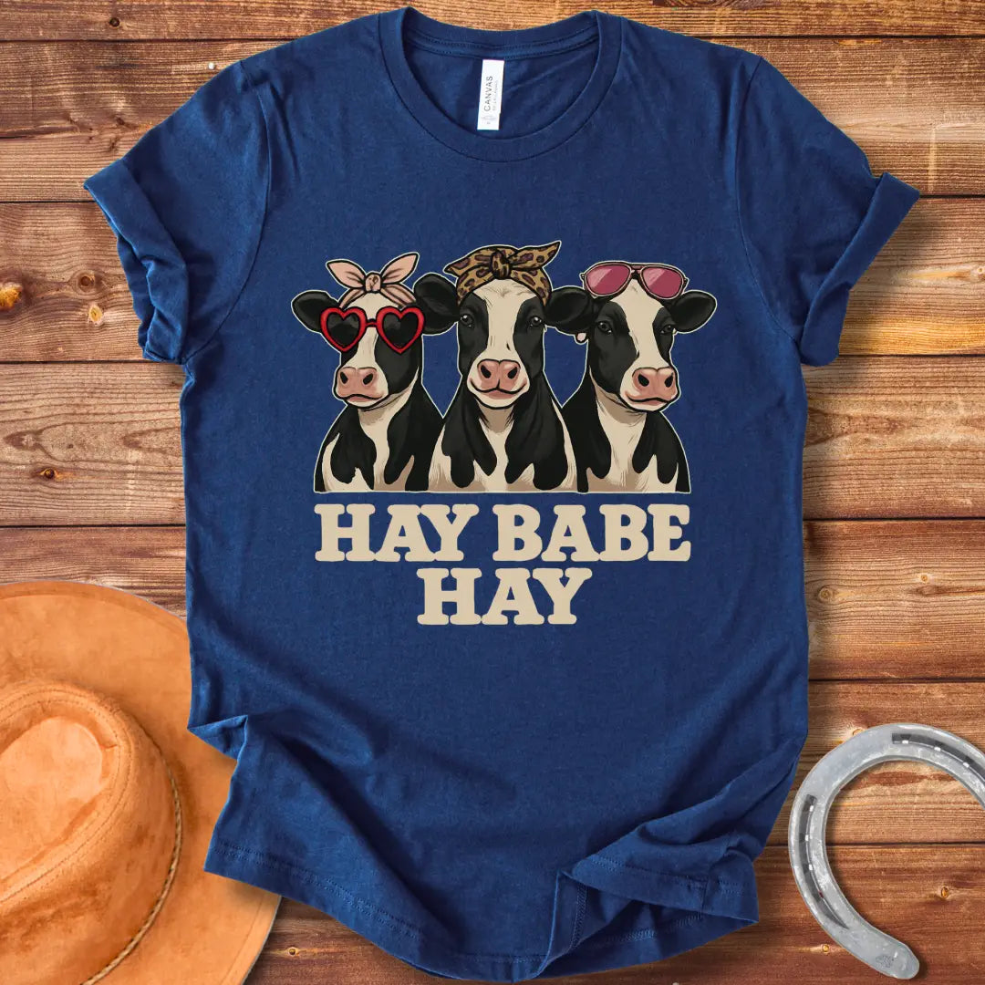 Hay Babe Hay T-Shirt featuring three stylish cows wearing sunglasses and bandanas. Text reads 'Hay Babe Hay'.