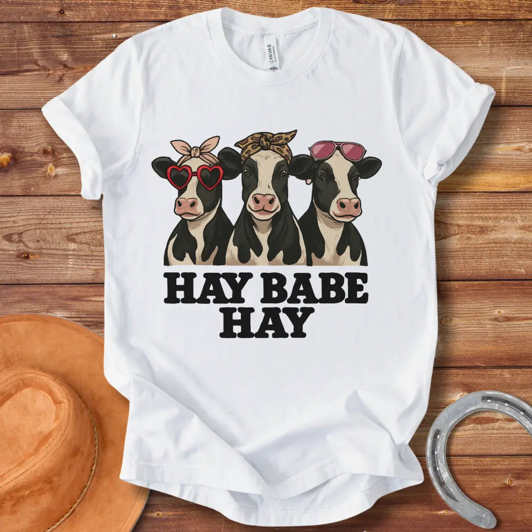 Hay Babe Hay T-Shirt featuring three stylish cows wearing sunglasses and bandanas. Text reads 'Hay Babe Hay'.