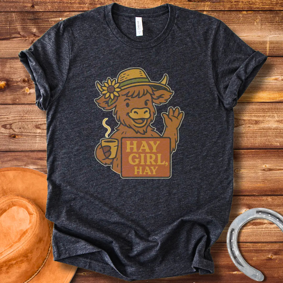 Illustration of a friendly cow wearing a hat with a sunflower, holding a mug and sign that reads 'Hay Girl, Hay'.