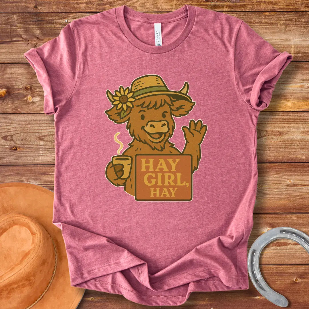 Illustration of a friendly cow wearing a hat with a sunflower, holding a mug and sign that reads 'Hay Girl, Hay'.