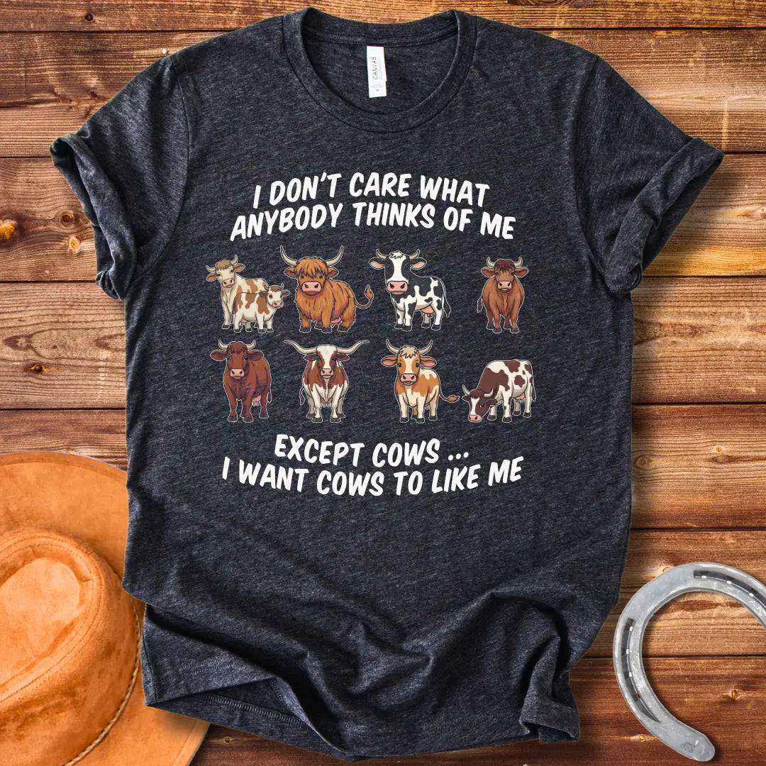 T-shirt design featuring multiple cartoon cow breeds with the phrase 'I Don't Care About Anybody Except Cows' on a black background.