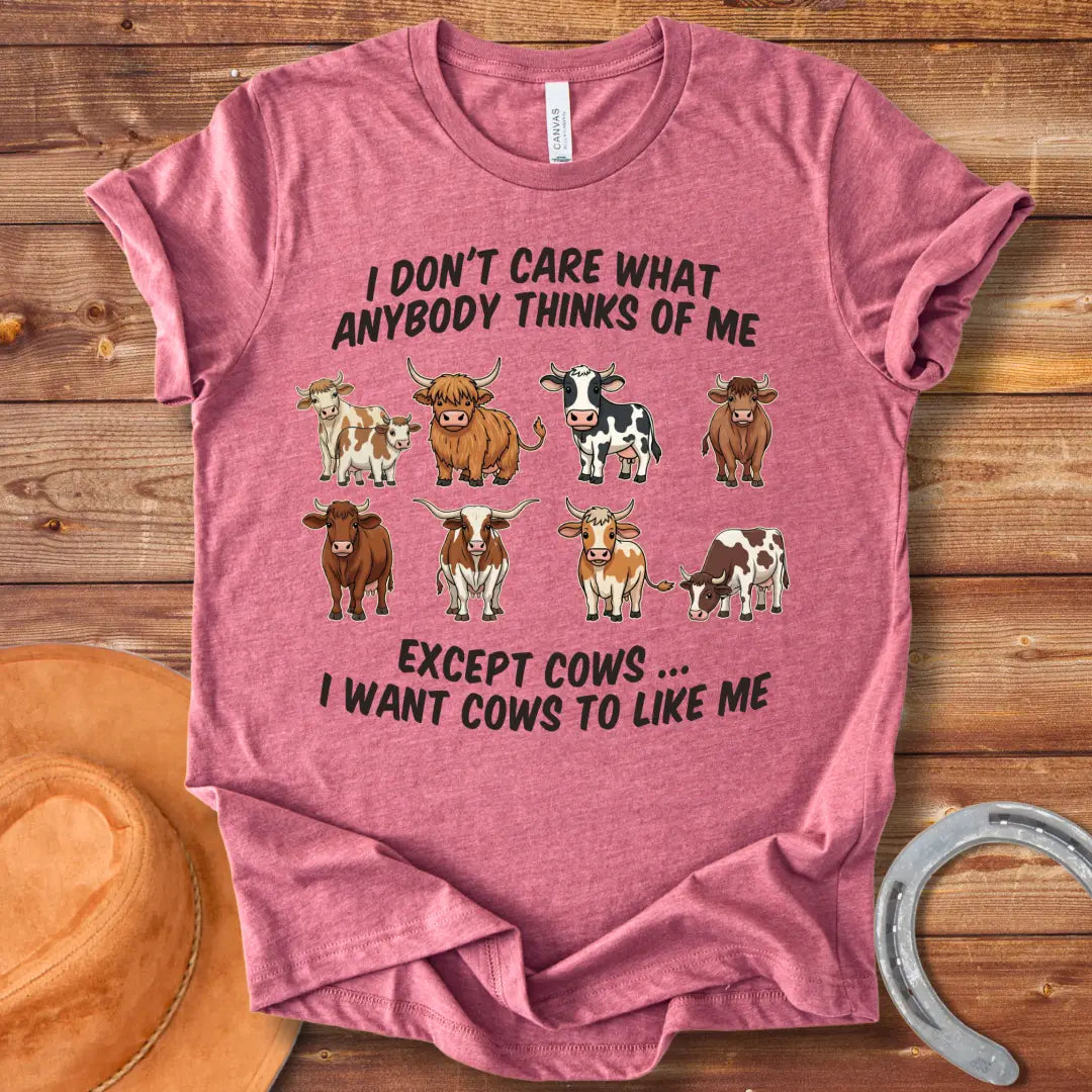 T-shirt design featuring multiple cartoon cow breeds with the phrase 'I Don't Care About Anybody Except Cows' on a black background.