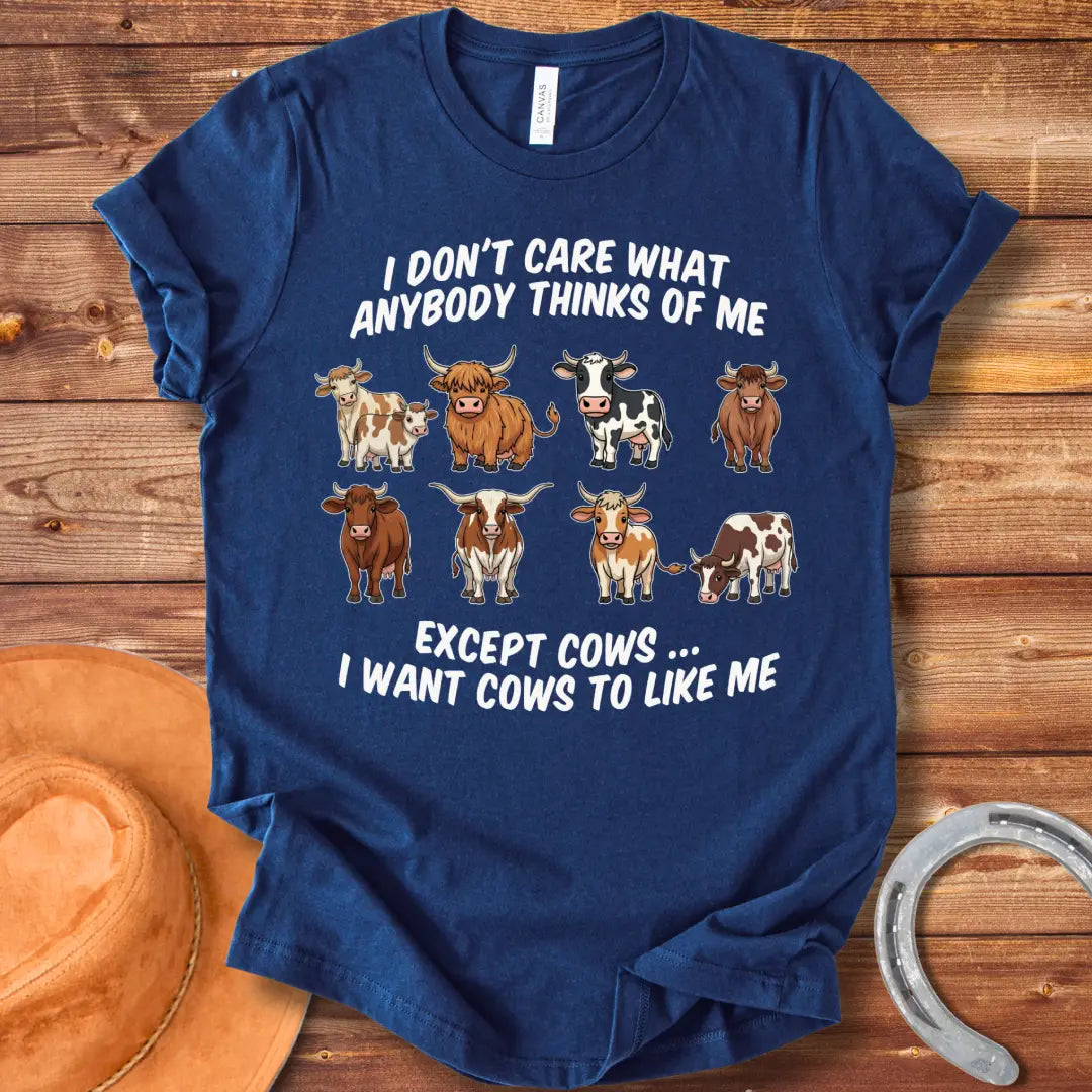 T-shirt design featuring multiple cartoon cow breeds with the phrase 'I Don't Care About Anybody Except Cows' on a black background.